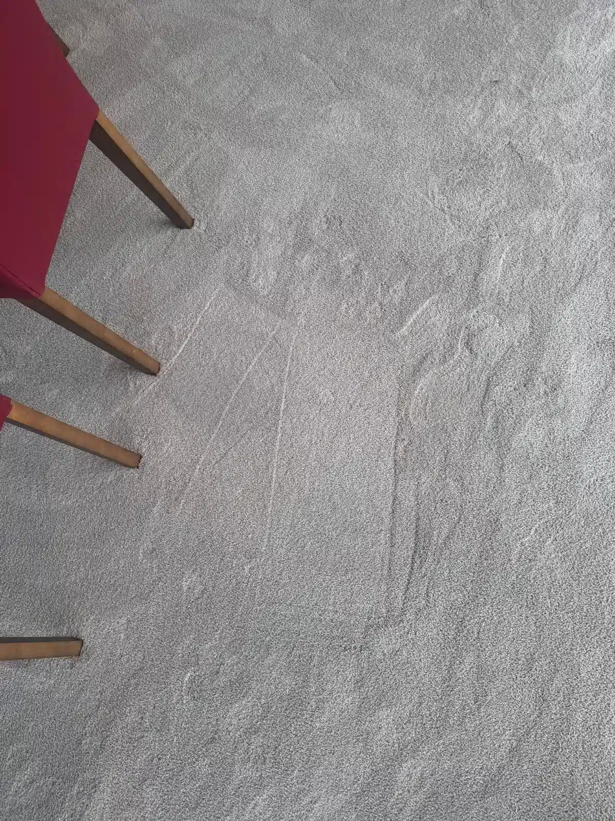 The same grey dining area carpet after hot water extraction, soil marks removed