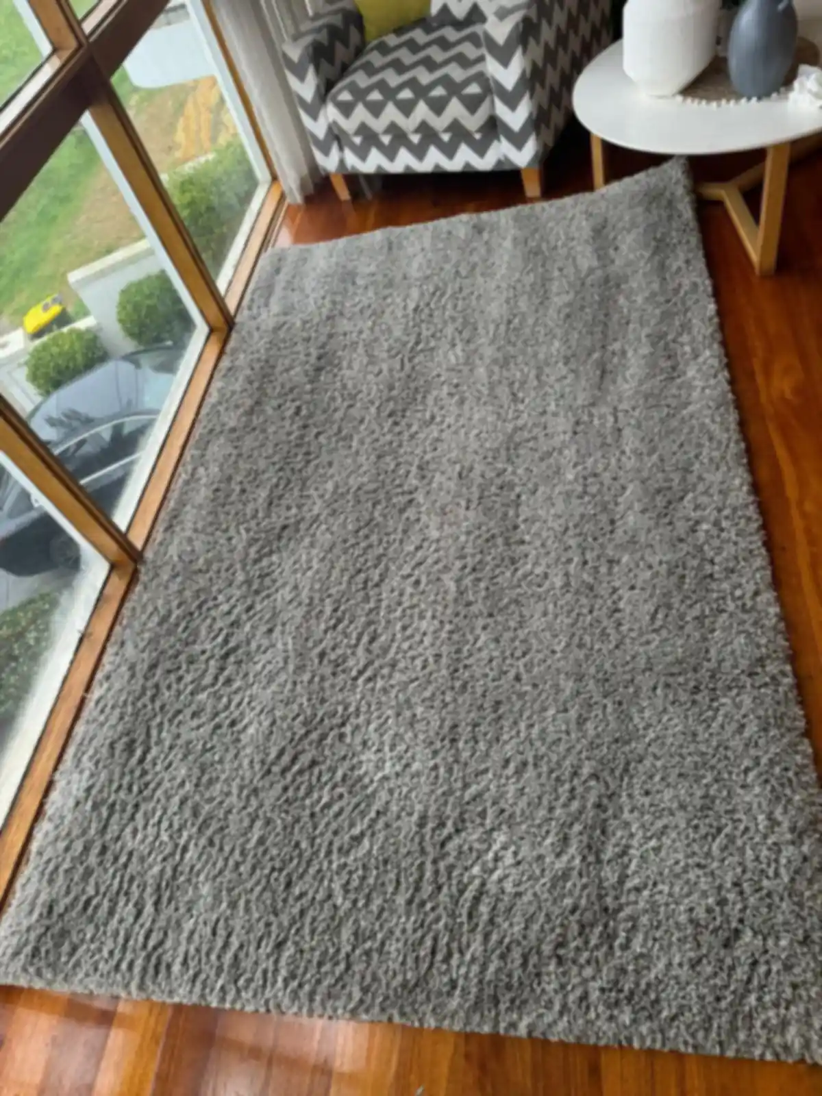Freshly cleaned grey shag rug in a bright Melbourne sunroom