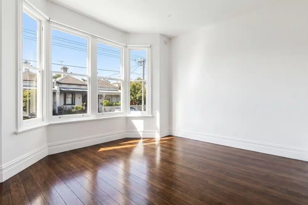Clean empty room with timber floors ready for the agent's inspection