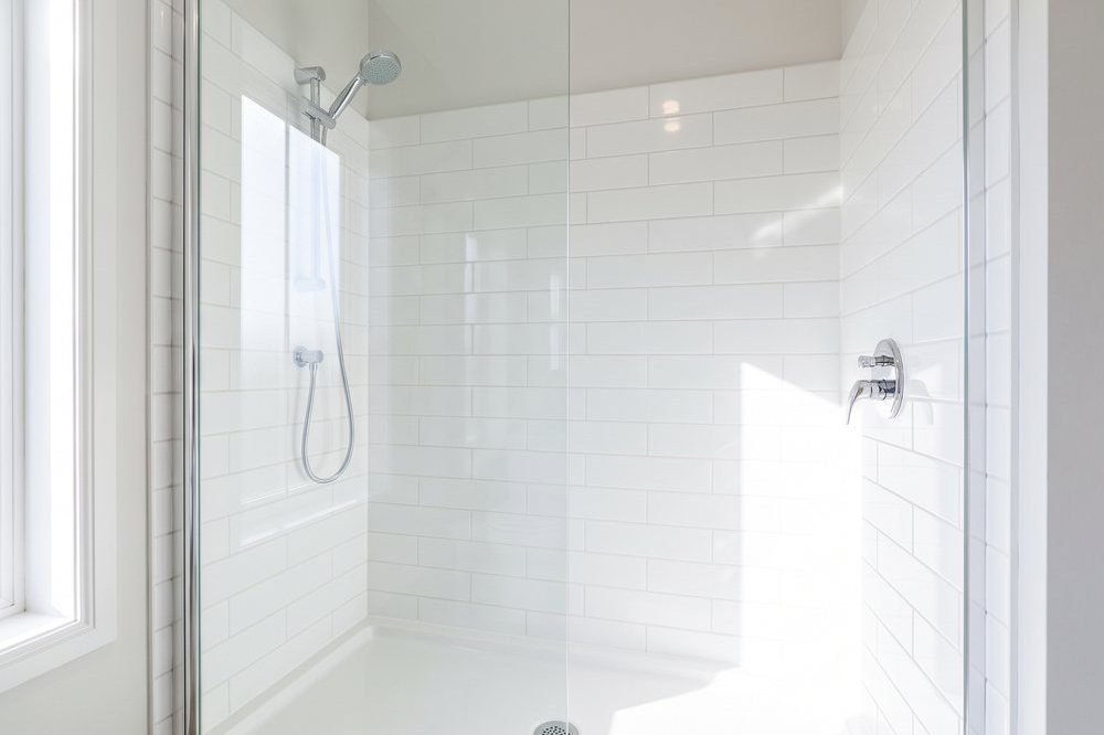 Spotless shower with clean tiles and glass after an end of lease clean